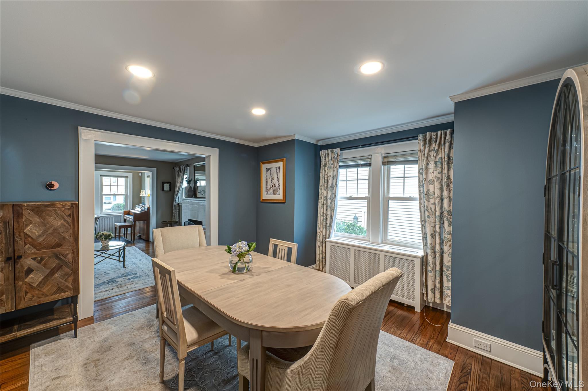 75 Bar Beach Road Port Washington, NY 11050 - Photo 9 of 30 a view of a dining room with furniture window and wooden floor