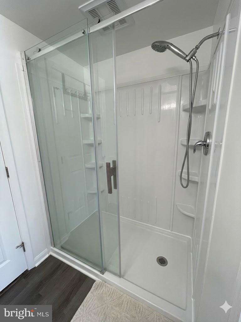 172 Rogers Mill Road Strasburg, VA 22657 - Photo 17 of 23 a bathroom with a glass shower door