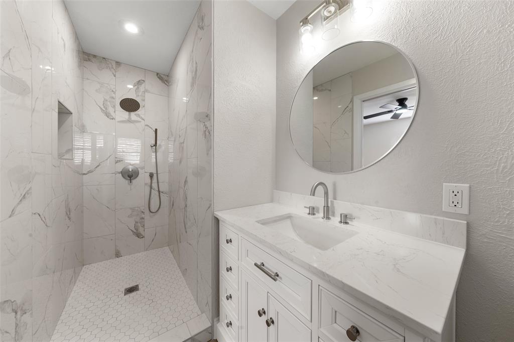 1312 Crow Drive Waco, TX 76705 - Photo 11 of 22 a bathroom with a sink a toilet and shower