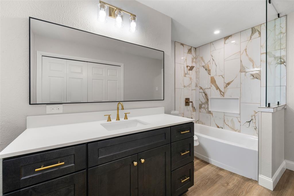 1312 Crow Drive Waco, TX 76705 - Photo 13 of 22 a bathroom with a bathtub sink double and mirror