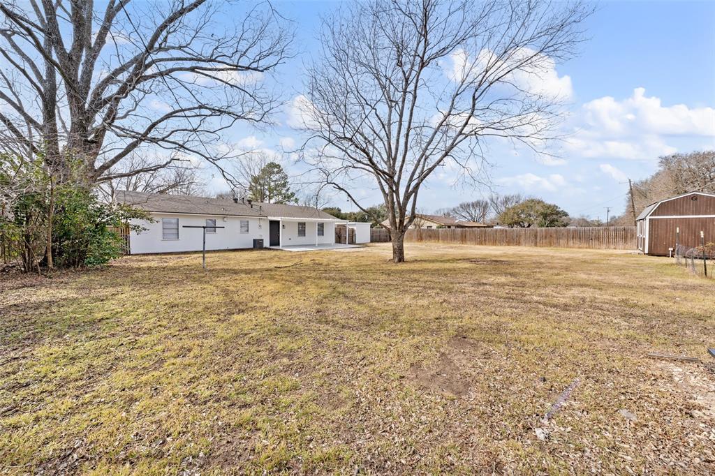 1312 Crow Drive Waco, TX 76705 - Photo 17 of 22 a house with trees in front of it