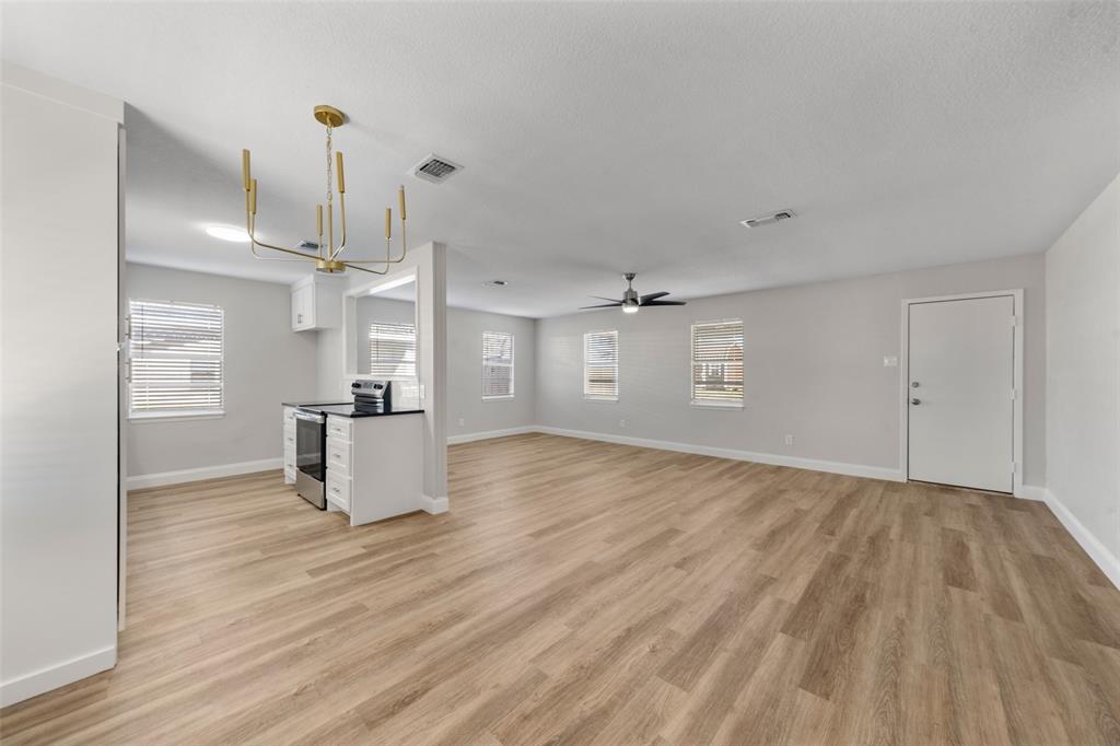 1312 Crow Drive Waco, TX 76705 - Photo 5 of 22 a view of empty room with wooden floor
