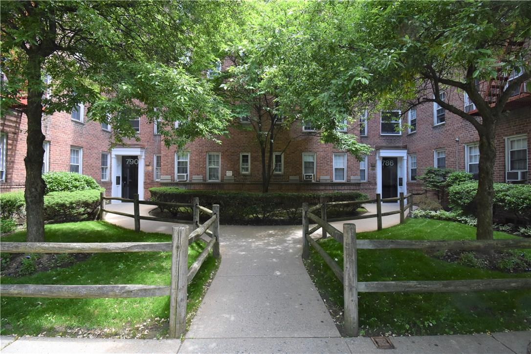 790 Bronx River Road, Unit A38 Bronxville, NY 10708 - Photo 1 of 1 a front view of house with yard and green space