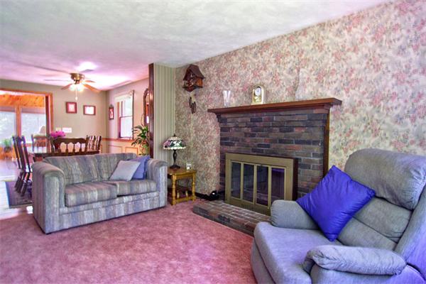 38 Whiting Road Oxford, MA 01540 - Photo 5 of 24 a living room with furniture and a fireplace