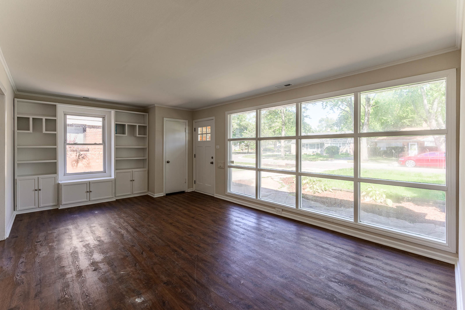 2119 Hawthorne Road Homewood, IL 60430 - Photo 2 of 9 an empty room with wooden floor and windows