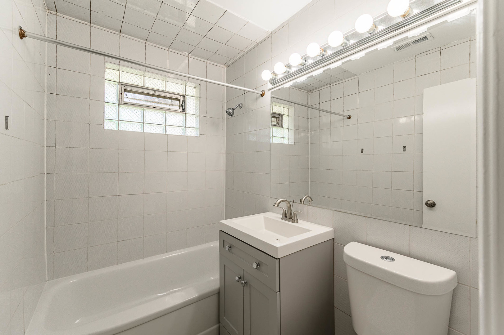 2119 Hawthorne Road Homewood, IL 60430 - Photo 6 of 9 a bathroom with a sink a toilet and shower