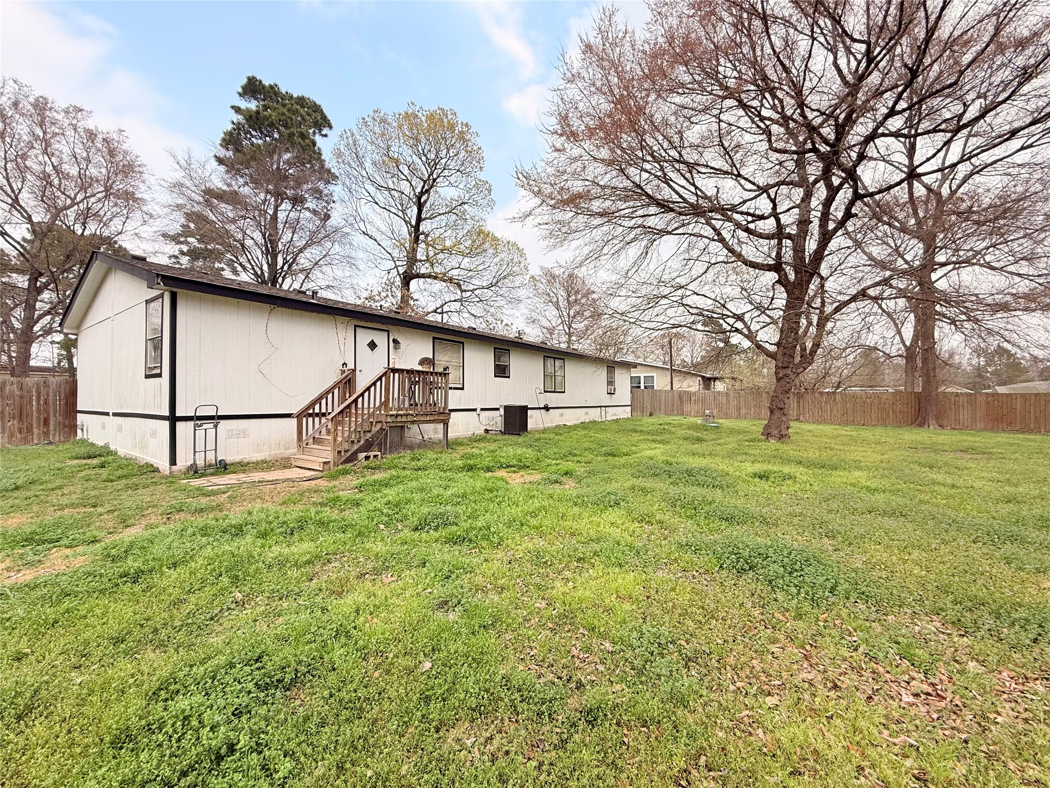 25351 Bluff View Court Magnolia, TX 77355 - Photo 8 of 9 a backyard of a house with lots of green space