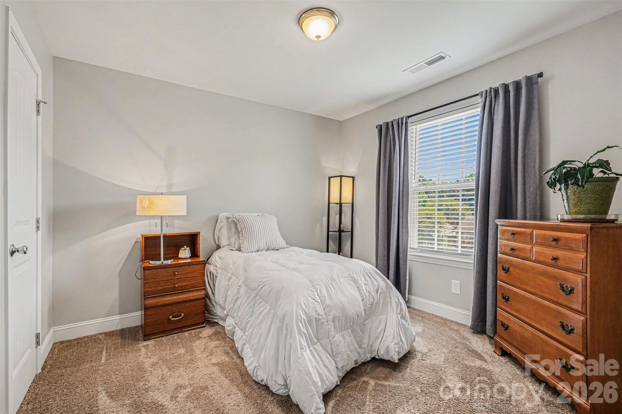 1610 Walter Hasty Road Monroe, NC 28110 - Photo 25 of 32 a bedroom with a bed and a dresser