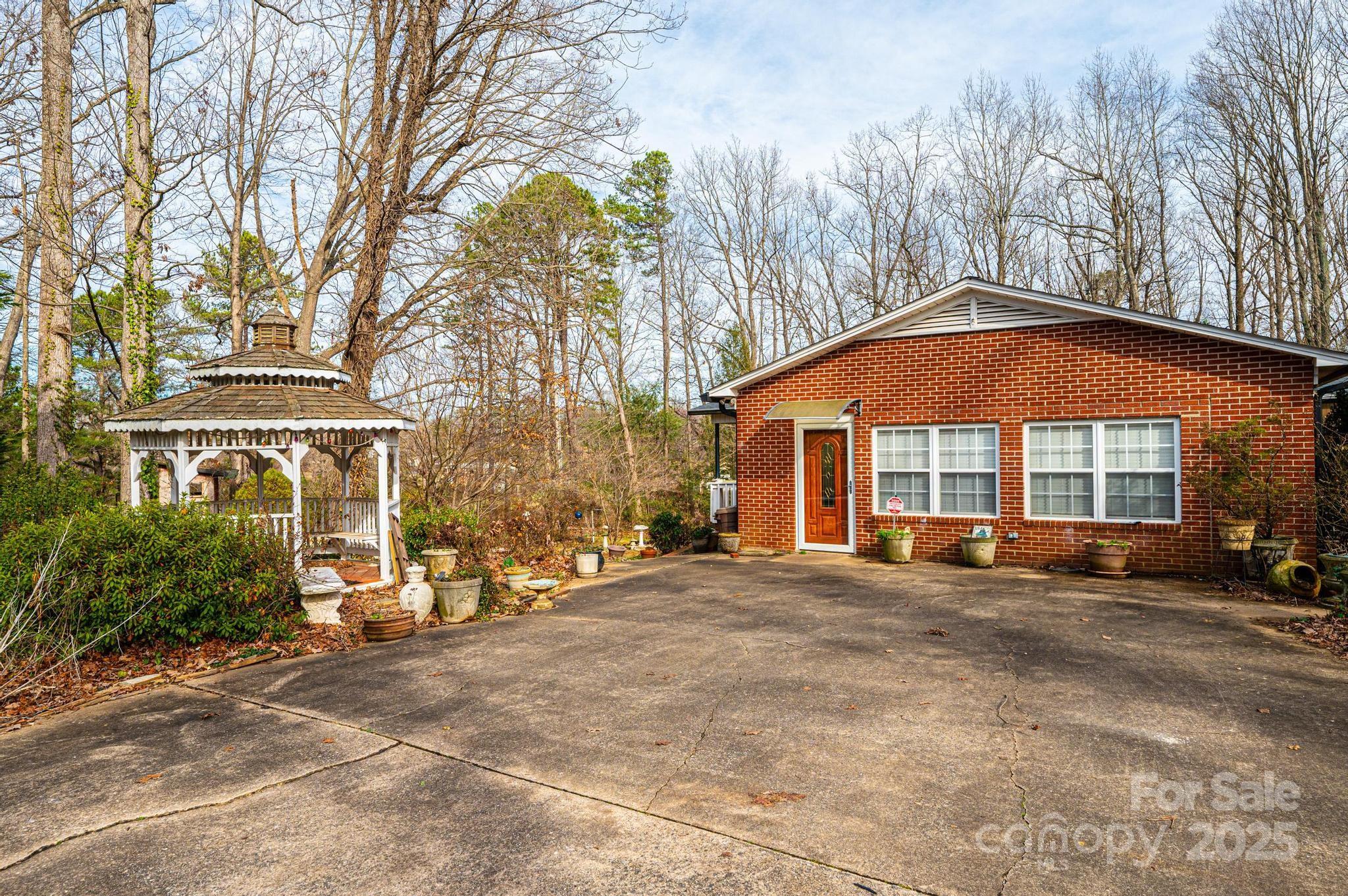 6000 George Hildebran School Road Hickory, NC 28602 - Photo 17 of 21 a view of a house with a yard and sitting area
