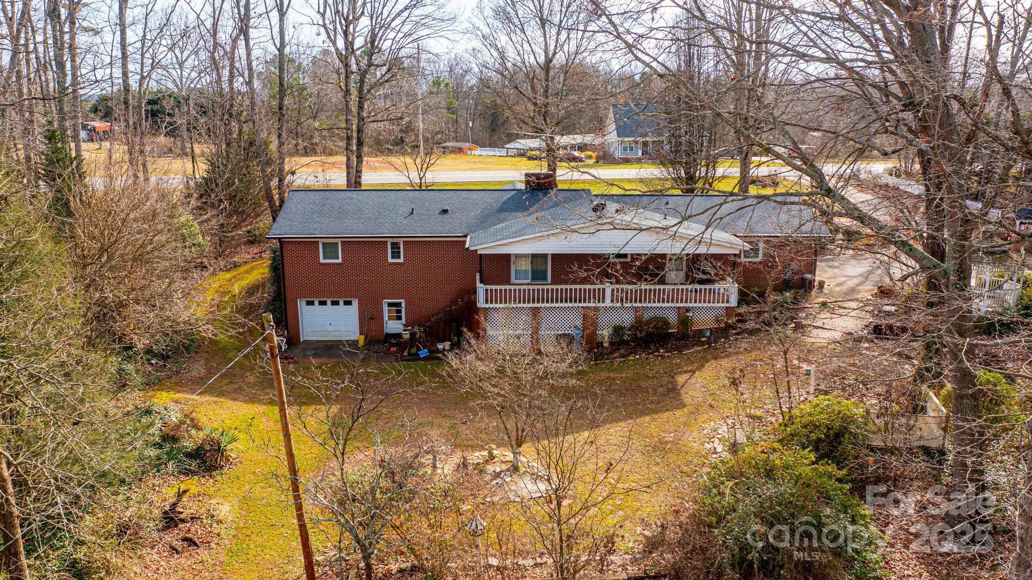 6000 George Hildebran School Road Hickory, NC 28602 - Photo 20 of 21 a view of a house with a yard covered with snow in the outdoor space