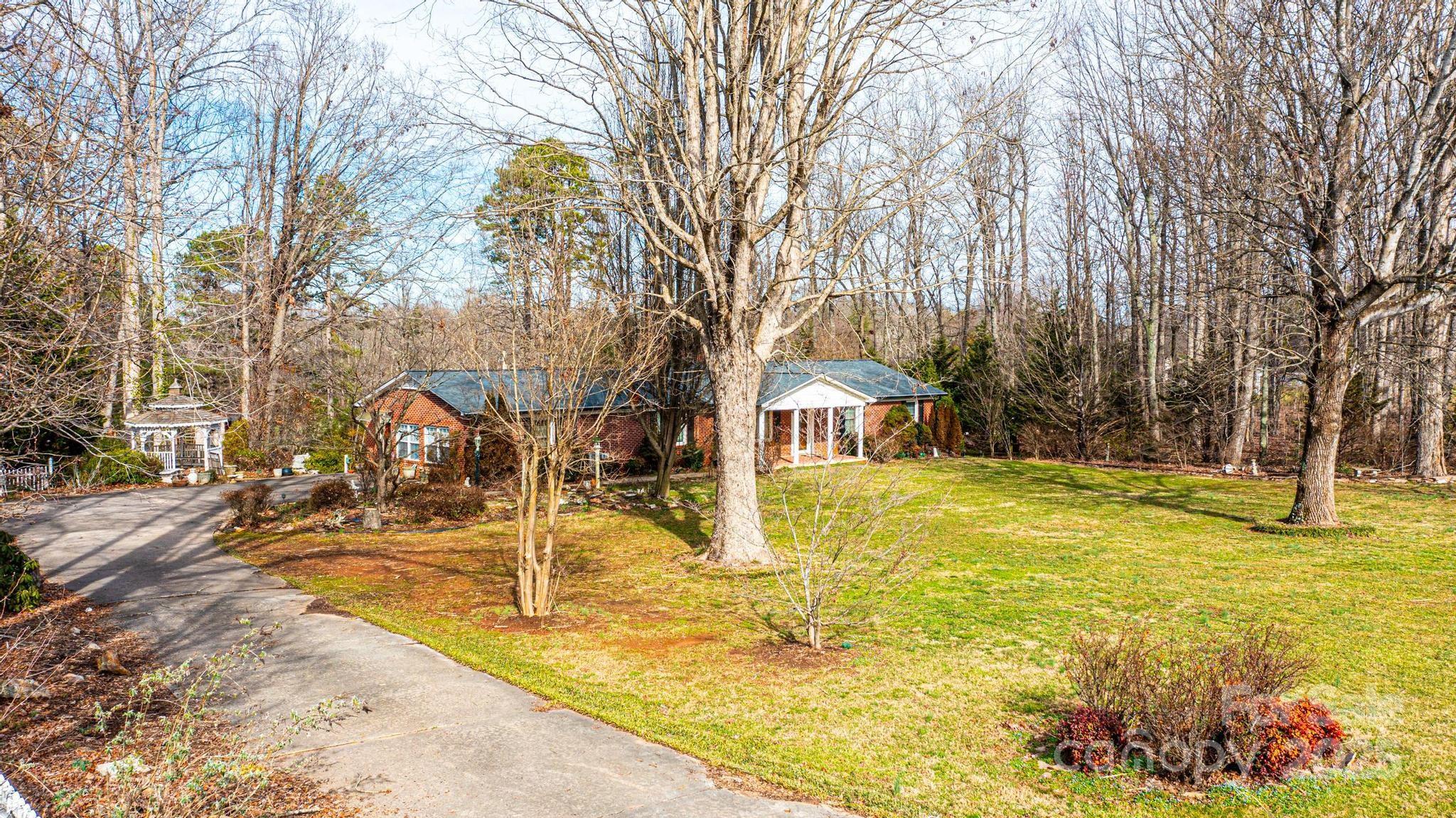 6000 George Hildebran School Road Hickory, NC 28602 - Photo 2 of 21 a view of a swimming pool with an outdoor space