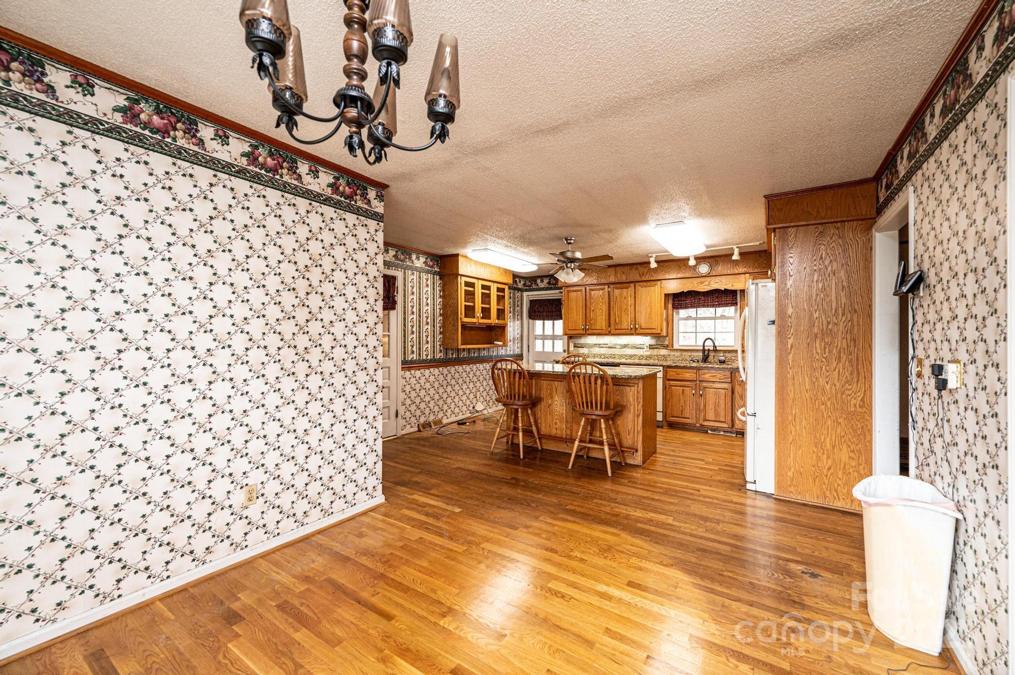 6000 George Hildebran School Road Hickory, NC 28602 - Photo 4 of 21 a view of a room with dining area wooden floor