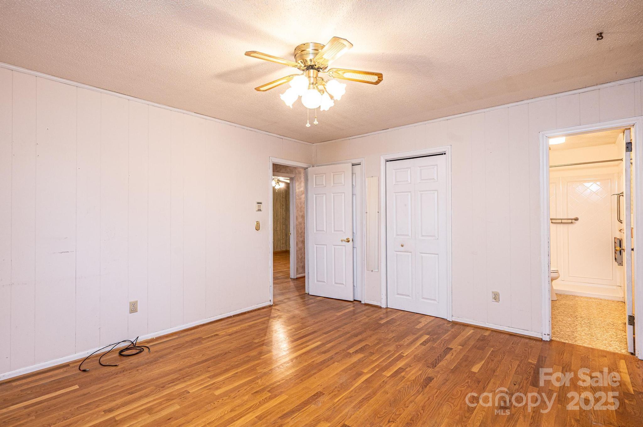 6000 George Hildebran School Road Hickory, NC 28602 - Photo 10 of 21 a view of an empty room with wooden floor