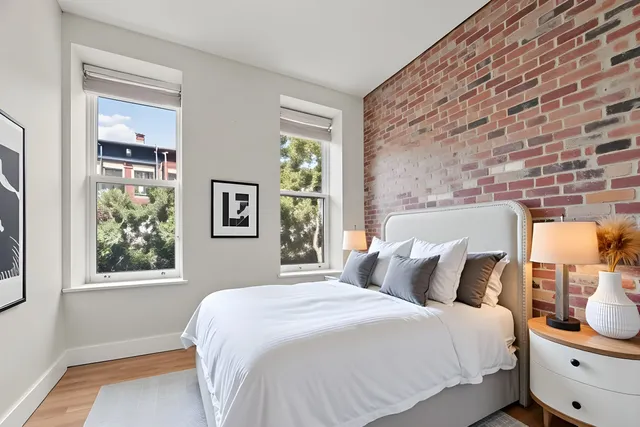 a kitchen with stainless steel appliances granite countertop a sink a stove a microwave and cabinets