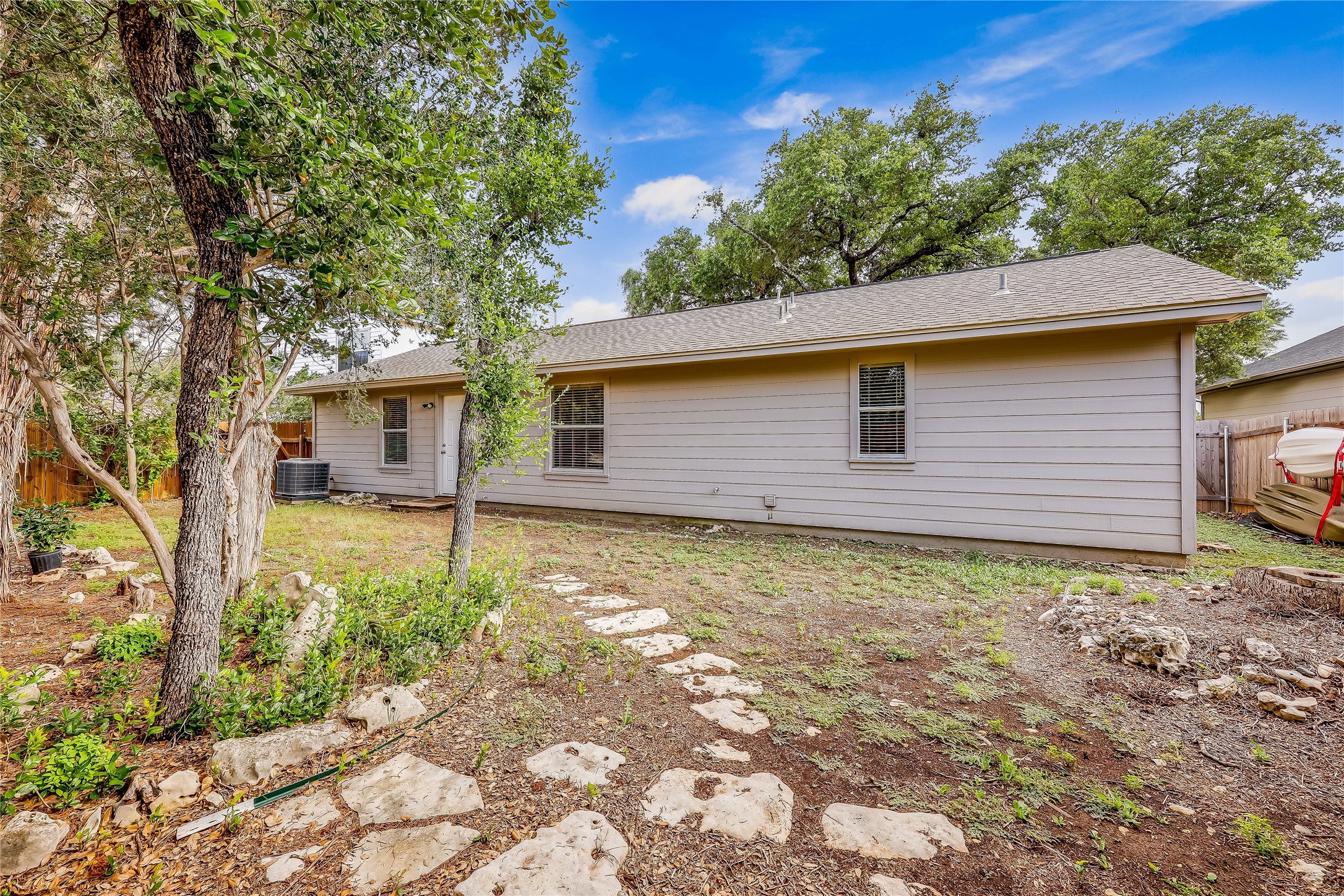 426 Summit Ridge Drive North Point Venture, TX 78645 - Photo 28 of 28 Back of property featuring central AC