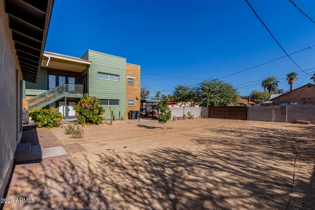 a wooden bench sitting in front of a building
