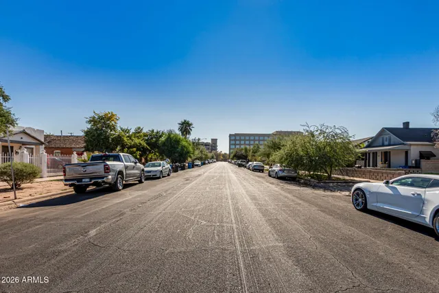a view of street with parked cars