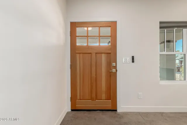 an empty room with wooden door