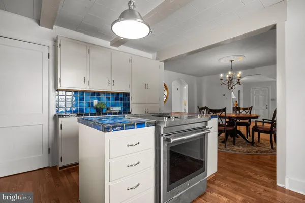 a kitchen with stainless steel appliances granite countertop a stove and a refrigerator