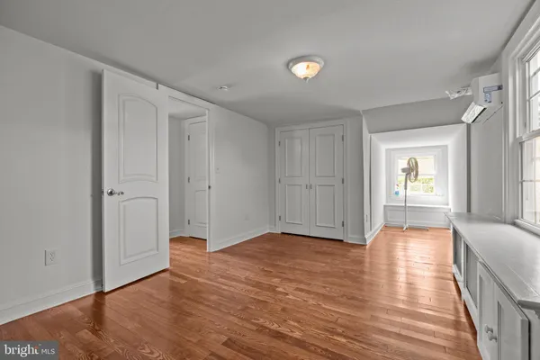 a view of livingroom with hardwood floor and hallway