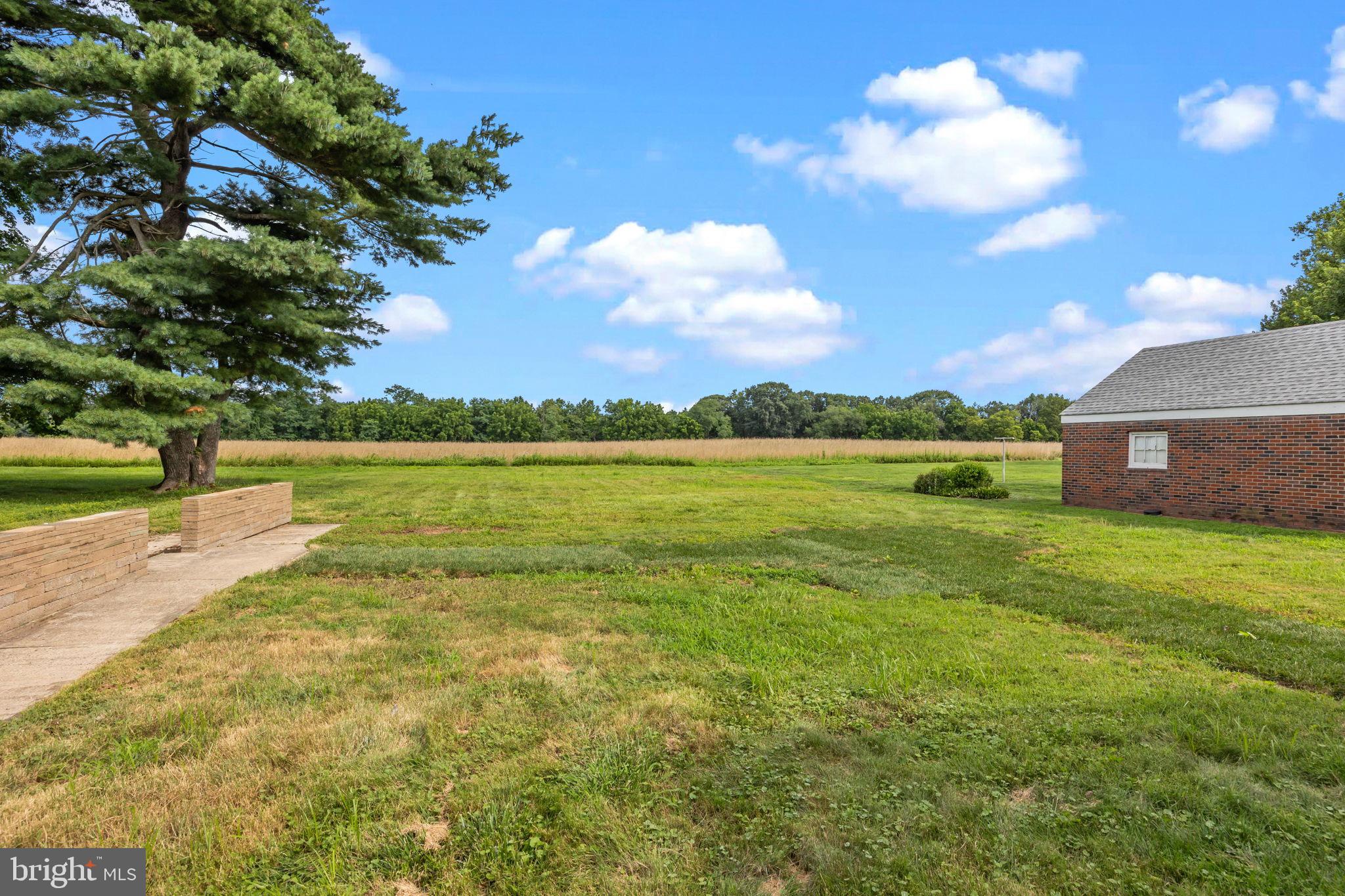 182 West Upper Ferry Ewing, NJ 08628 - Photo 28 of 33 Spacious green landscape under a blue sky.