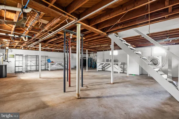 a view of a hall with wooden floor