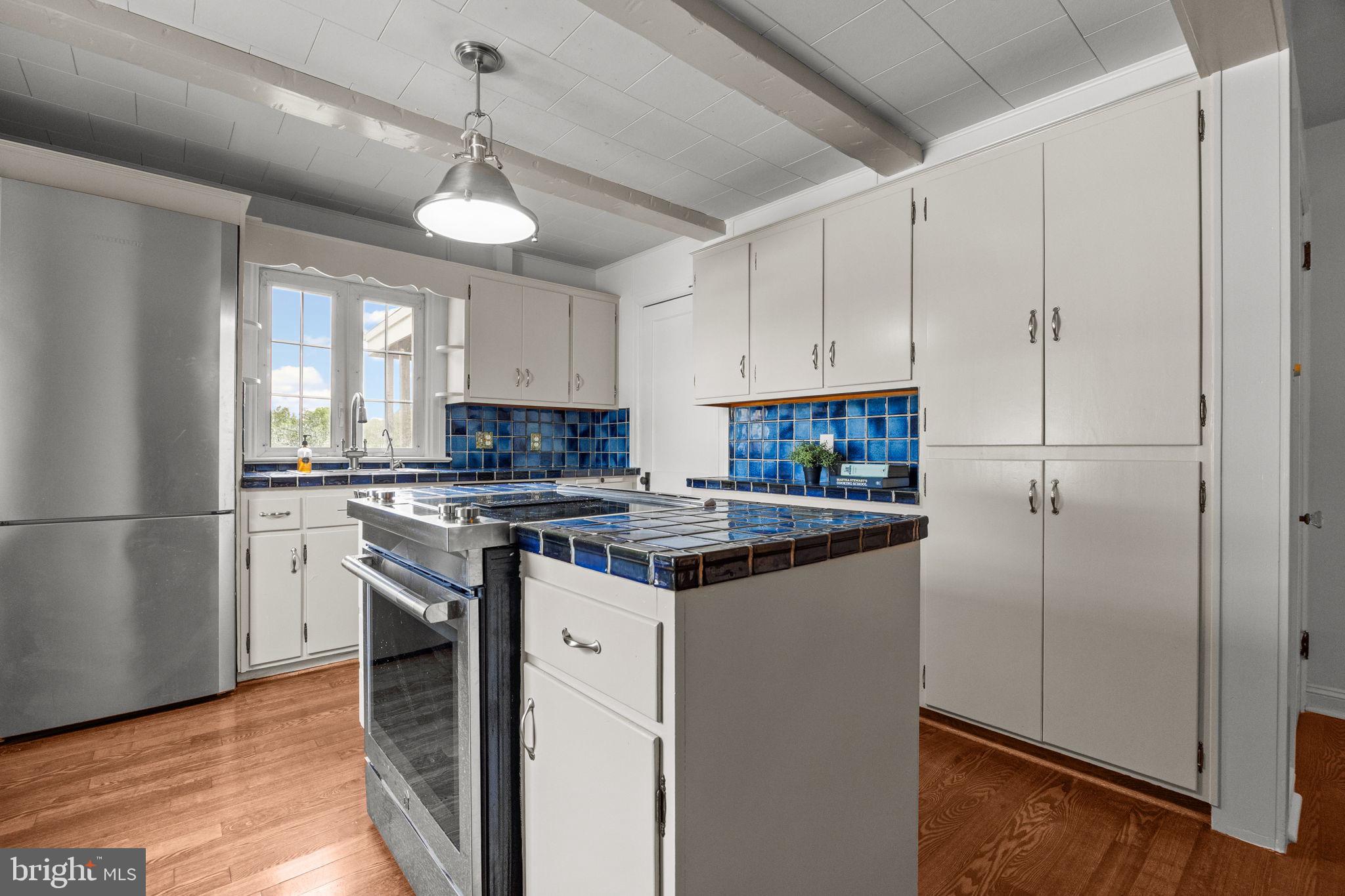 182 West Upper Ferry Ewing, NJ 08628 - Photo 9 of 33 Charming kitchen with vibrant blue accents.