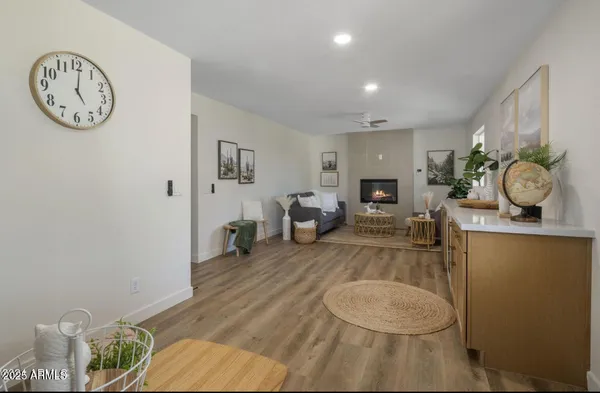 a view of cabinets a wooden floor and windows