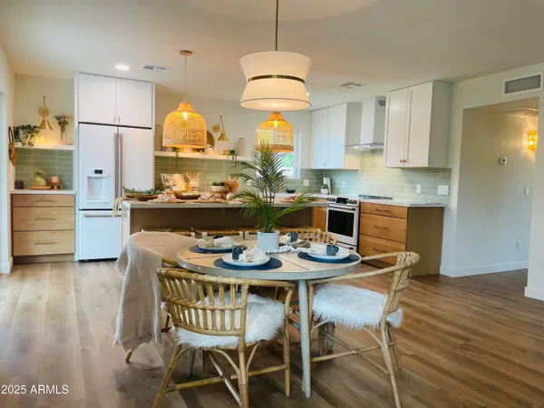a view of a dining room with furniture window and wooden floor