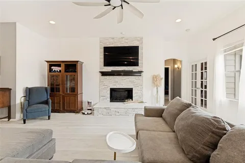 a living room with furniture fireplace and a flat screen tv