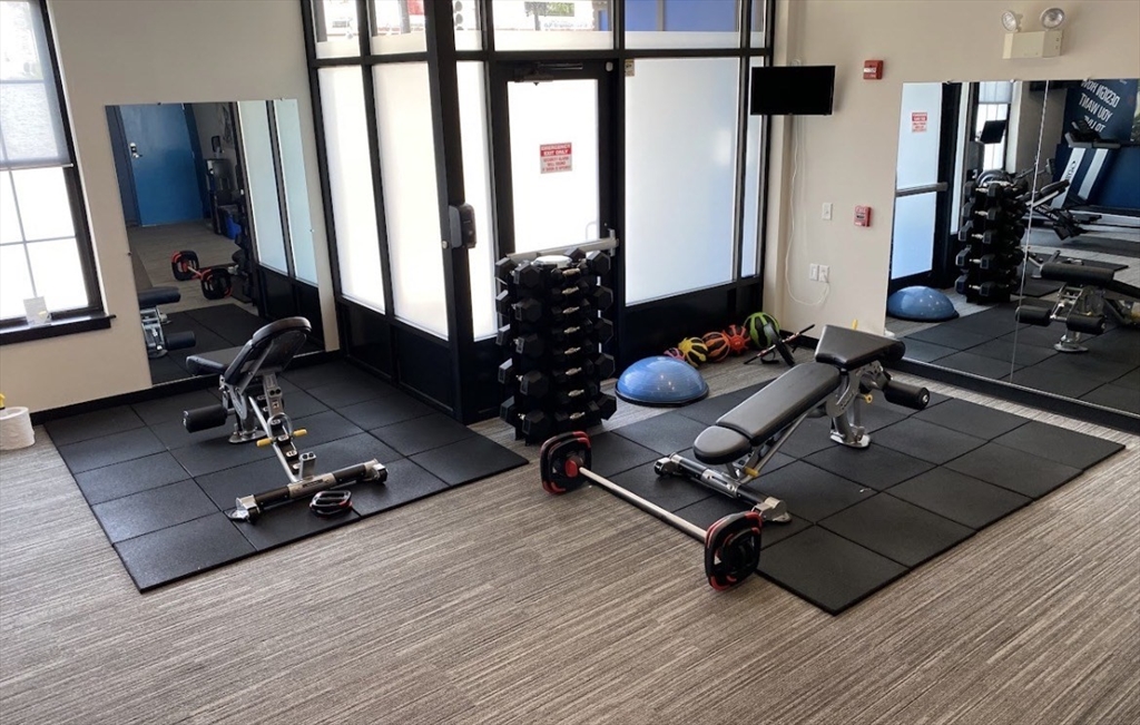 944 Dorchester Avenue, Unit 9 Boston, MA 02125 - Photo 28 of 29 a room with gym equipment and a large window