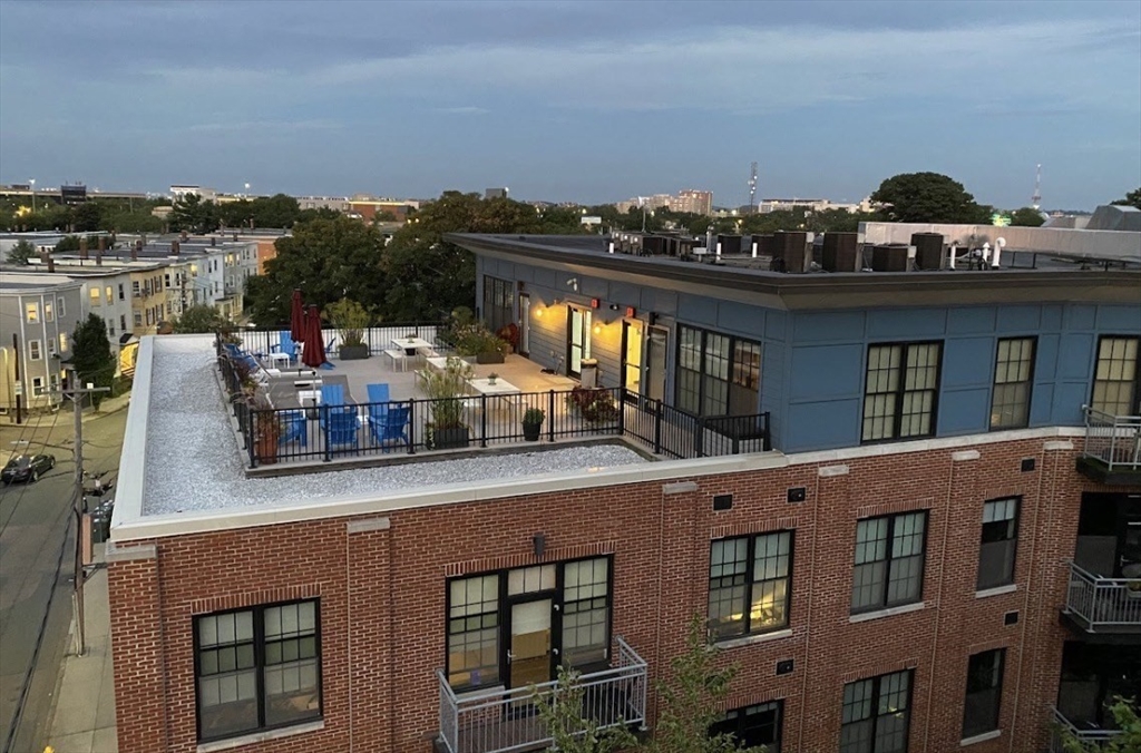 944 Dorchester Avenue, Unit 9 Boston, MA 02125 - Photo 4 of 29 a view of a building with a window and balcony