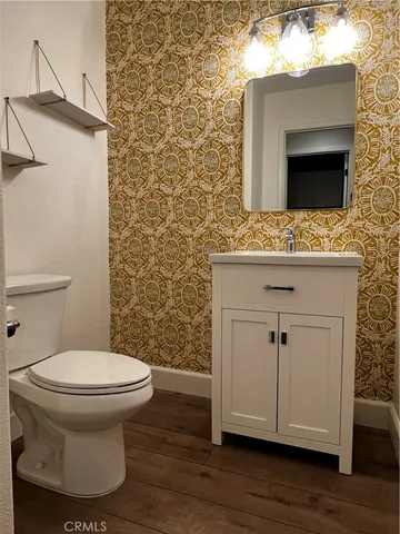 a bathroom with a toilet and a sink