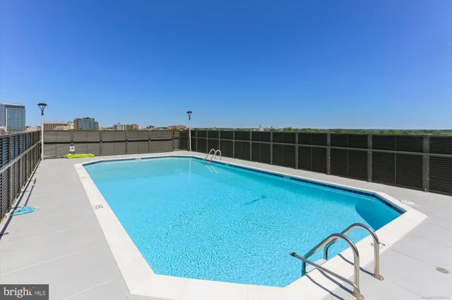 a view of a swimming pool with a lounge chair