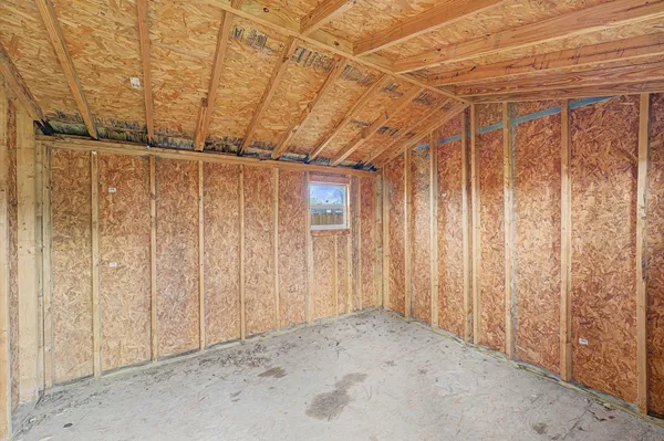 a view of a room with wooden walls