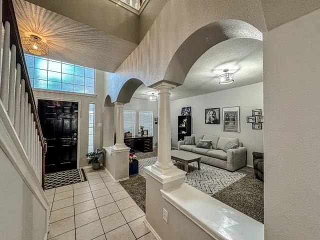 a view of a hallway view with staircase with kitchen view
