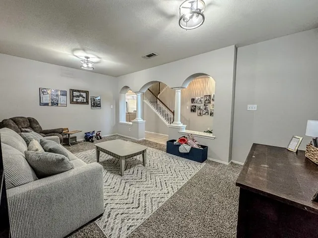 a kitchen with granite countertop a sink and a stove