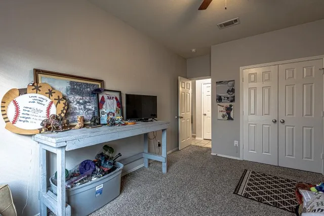 a living room with furniture and a mirror