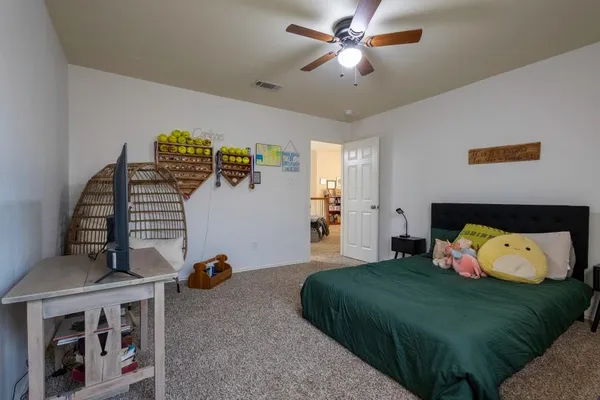 a bedroom with furniture and a window