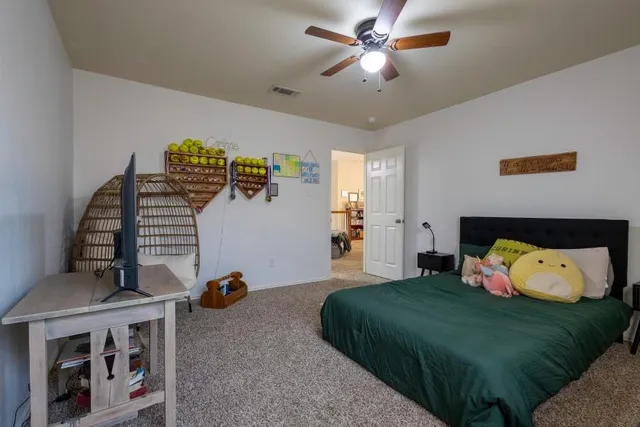 a bedroom with furniture and a window