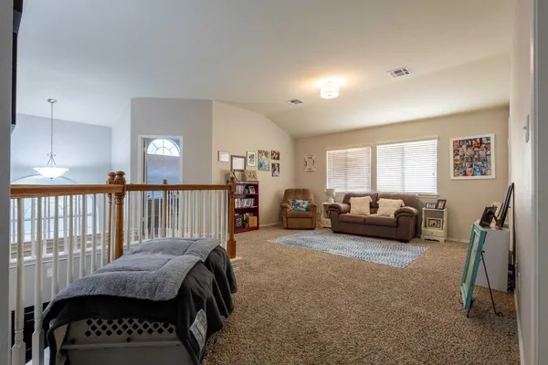 a bedroom with a bed and a couch