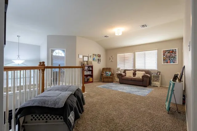 a bedroom with a bed and a couch