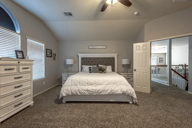 a bedroom with furniture and a window
