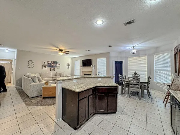a bedroom with a bed and ceiling fan