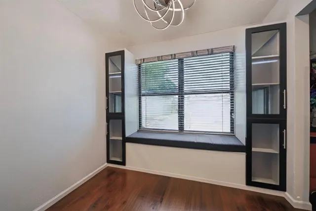 a bedroom with a bed and ceiling fan