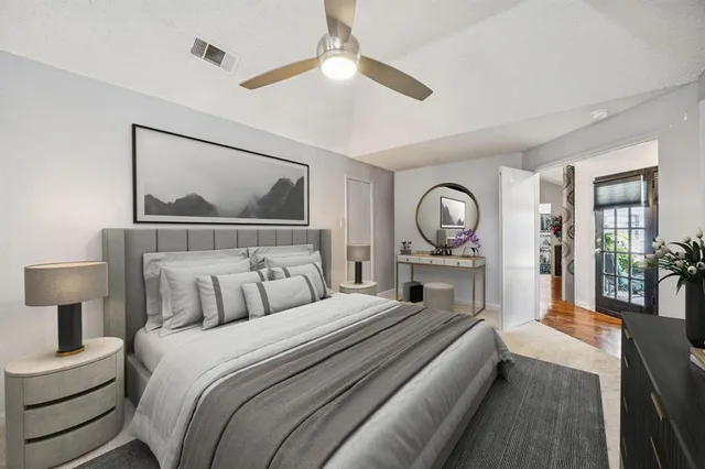 a bathroom with a sink vanity mirror and toilet