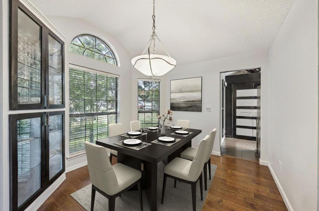 405 Rose Drive Allen, TX 75002 - Photo 4 of 31 The dining room is just off of the entry. This beautiful space enjoys a gorgeous chandelier, bay window letting in natural light, easy care engineered hardwood floors and easy access to the kitchen through the doorway shown. (virtually staged to show potential)