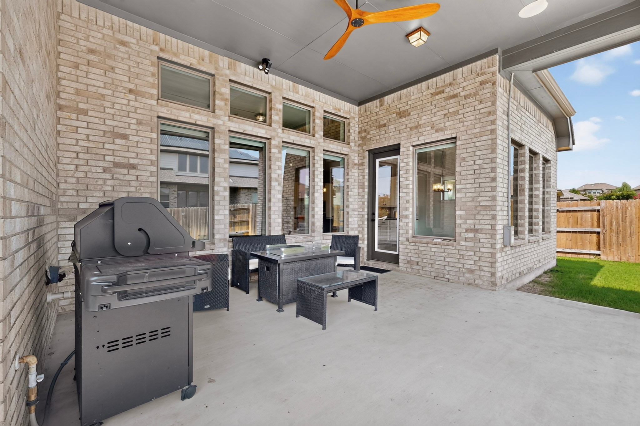 2433 La Mirada Street Leander, TX 78641 - Photo 19 of 25 A spacious covered patio offers ample room for outdoor dining and entertaining.