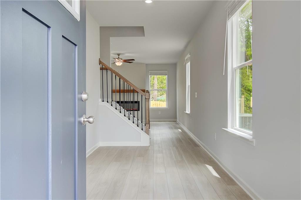 117 Alpine Road Fairburn, GA 30213 - Photo 4 of 29 a view of entryway and hall with wooden floor