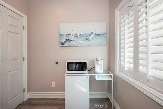 a bathroom with a granite countertop sink a toilet and shower